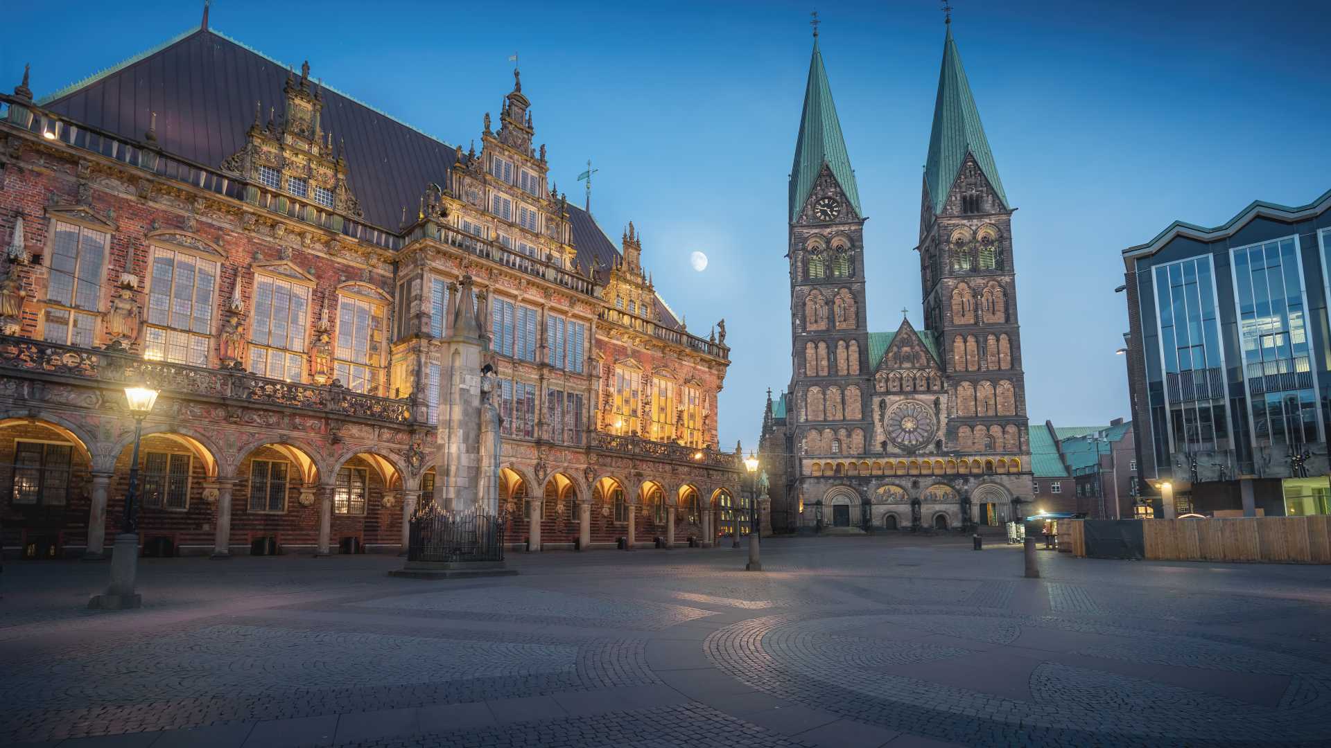 Bremen's Market Square at night, featuring the illuminated Cathedral and Old Town Hall.