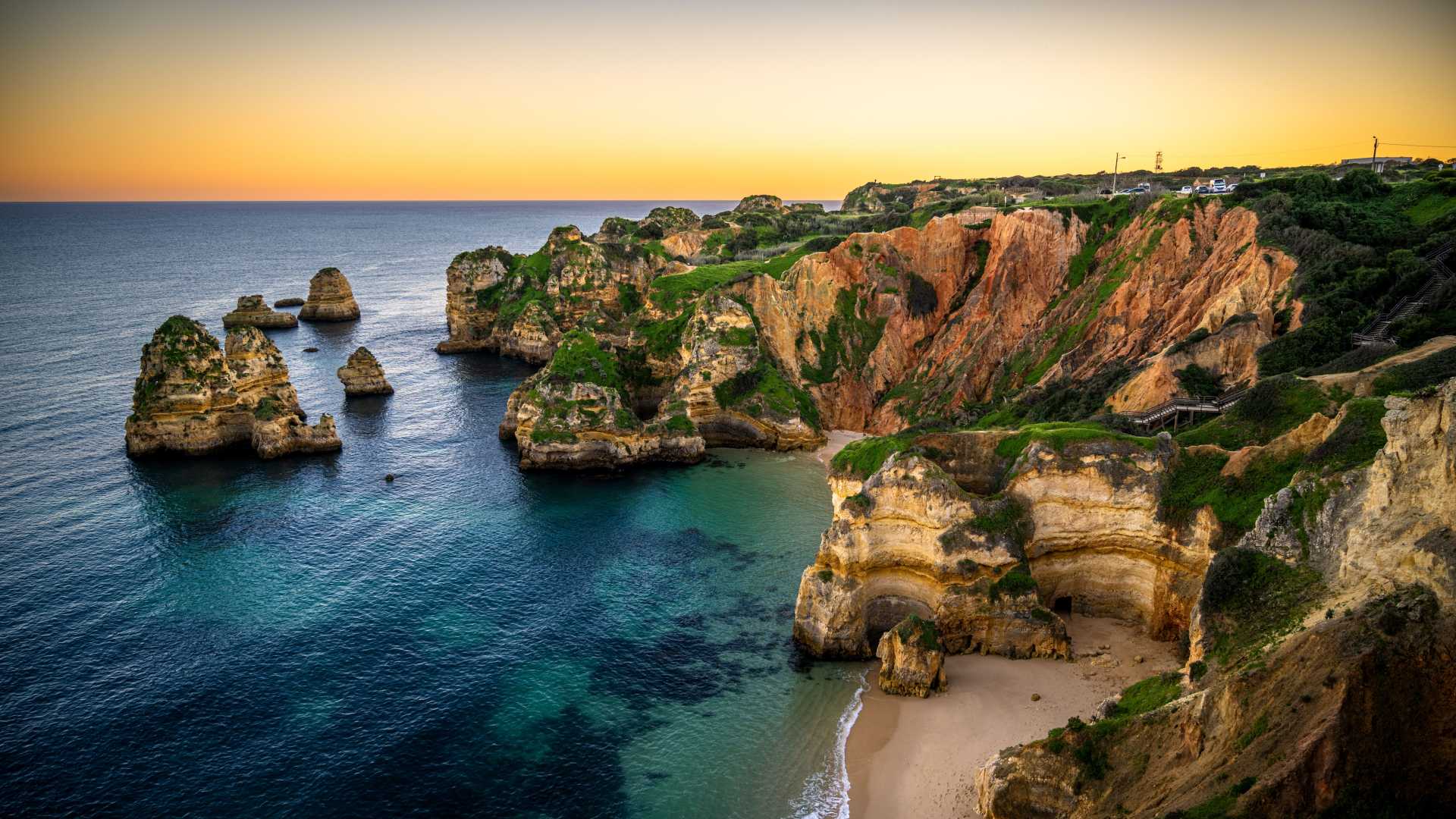 Golden sunset over the dramatic cliffs of Lagos, Portugal