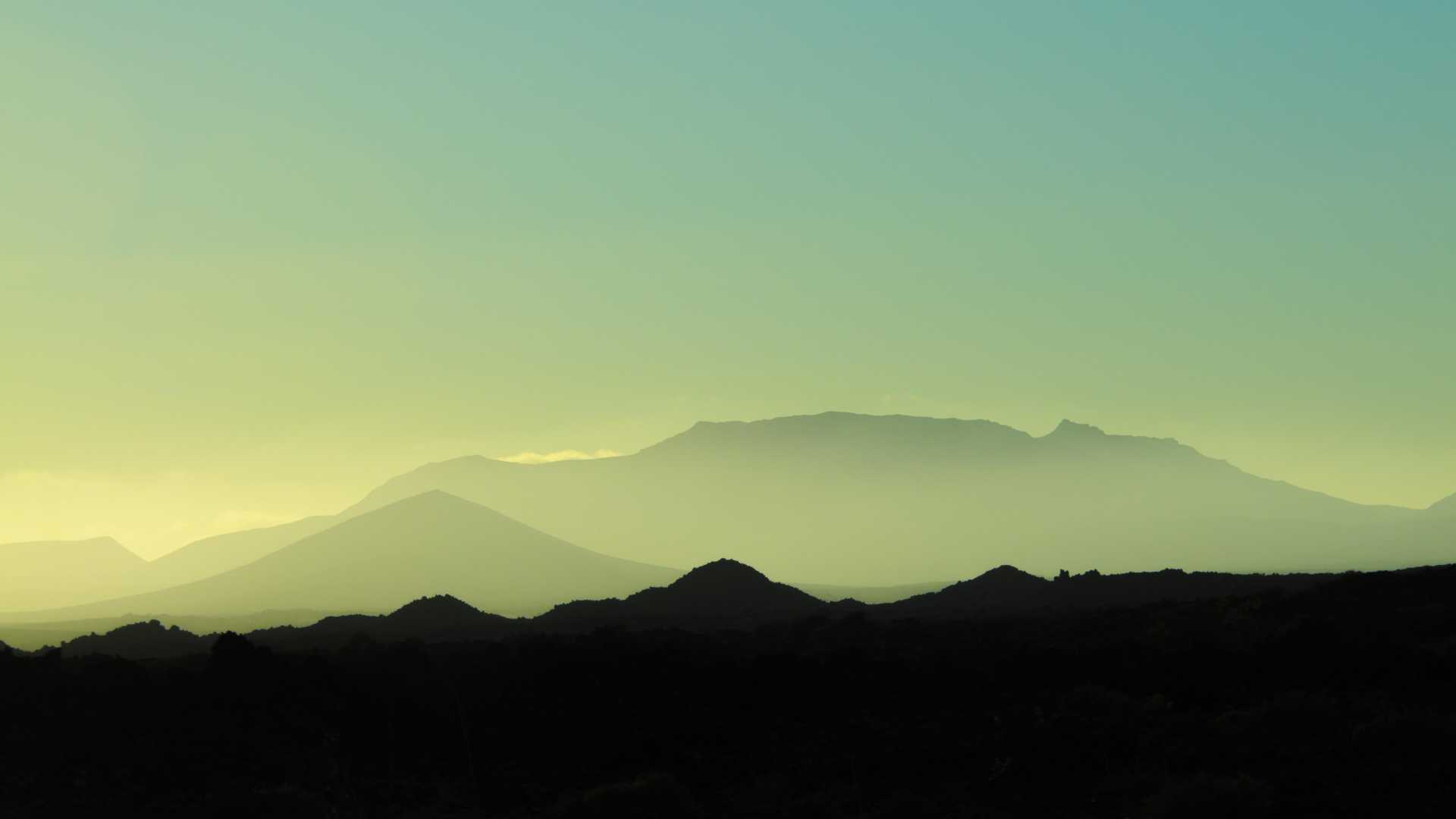 Silhouetted mountains against a pastel sky in Fuerteventura.